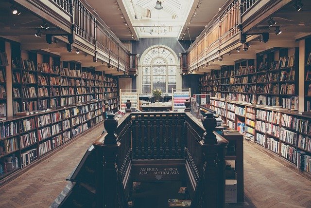 Student studying in a library, representing college planning